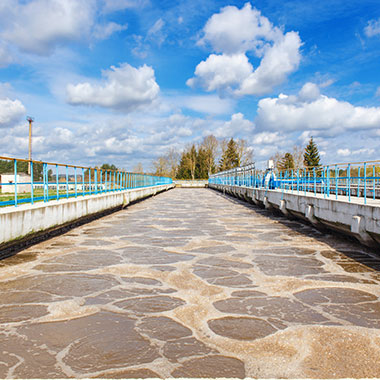 An aeration basin at a water treatment plant activates the biological sludge process. Water high in alkalinity present in dissolved minerals effect bacteria needed for digestion.